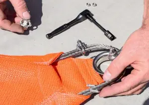 Place Cable Clamps on either side of the D Ring