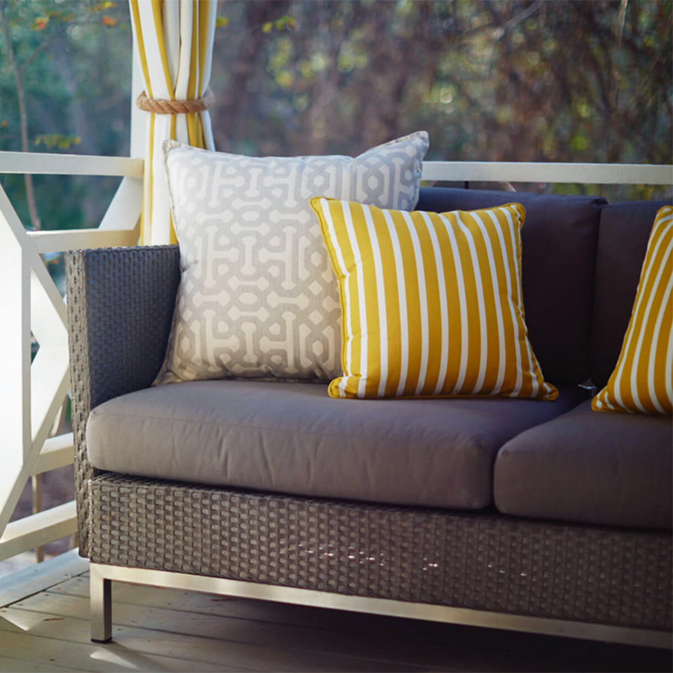 Custom outdoor cushions and pillows in coordinated striped fabric