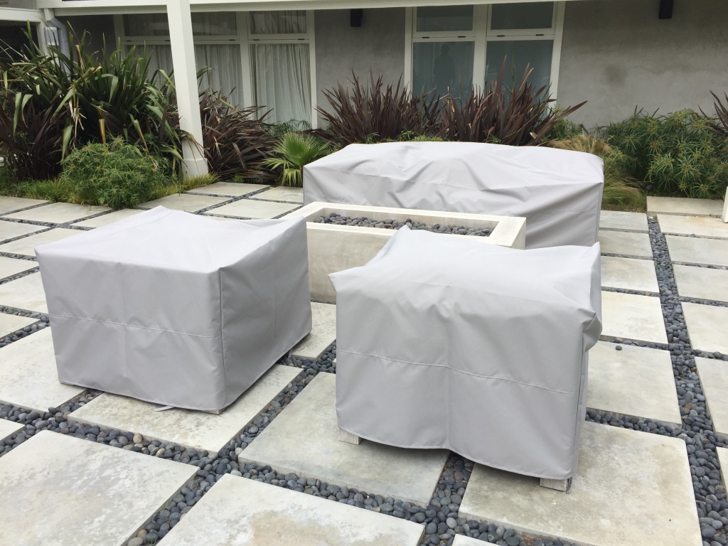Protective furniture covers in an outdoor patio setting