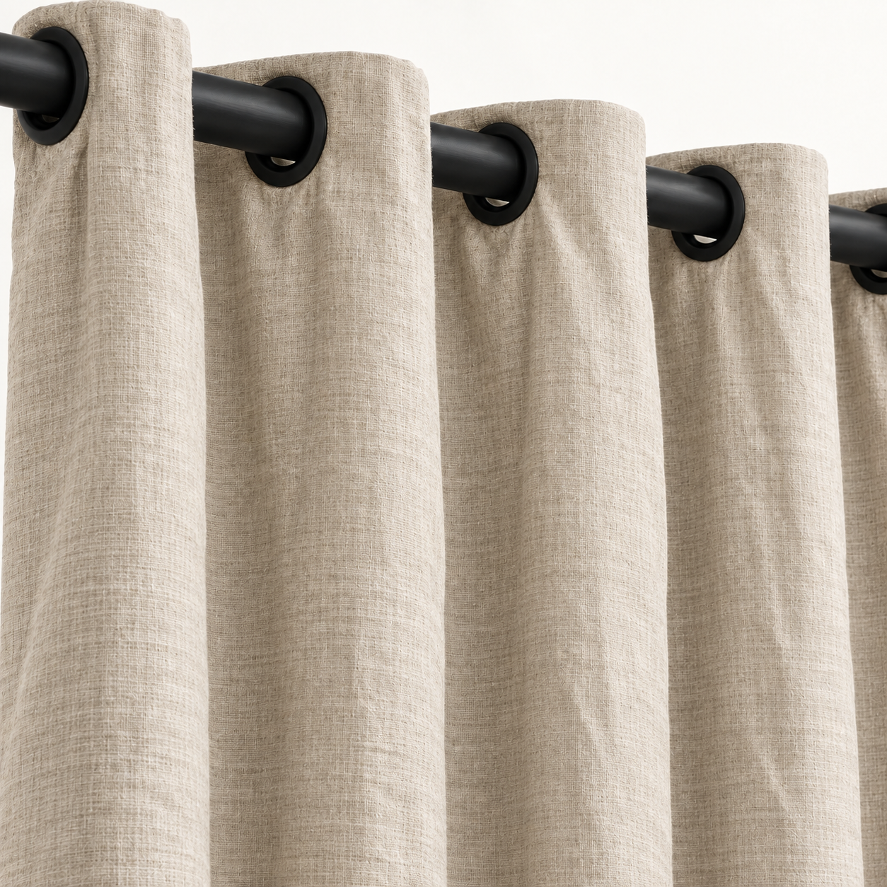 Oatmeal linen grommet drapery with black hardware