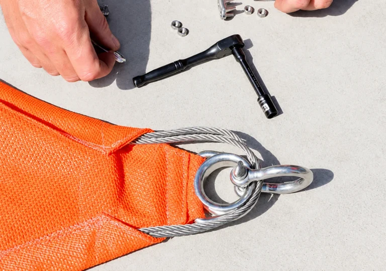 Both cable ends should be tucked into the pockets and looped around the D Ring and Thimble